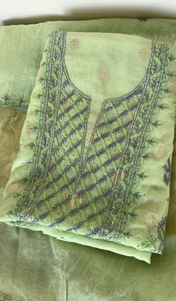 Green pure mul chanderi kurta piece folded, fine contrast chikankari