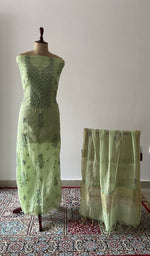 The set on the mannequin with its dupatta beside it