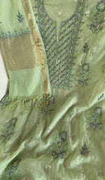 Motifs across the body of the green kurta