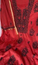 Motifs across the body of the red kurta