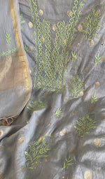 Motifs across the body of the grey kurta
