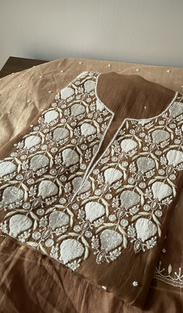 Brown mul chanderi kurta piece folded, badla and mukaish work in view