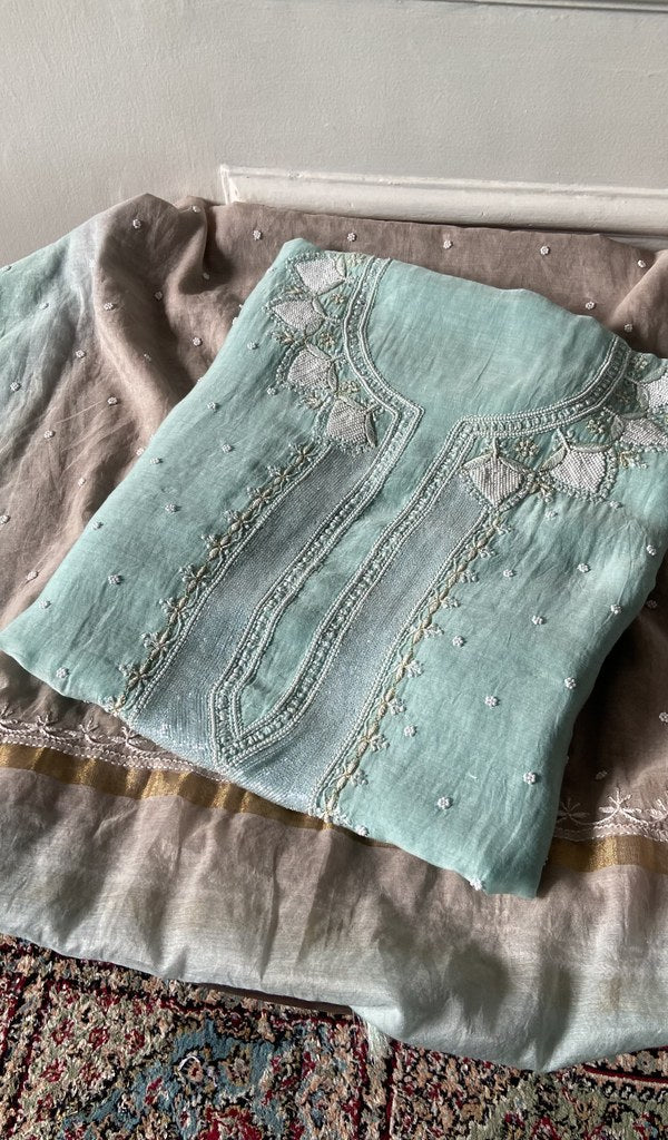 Aqua mul chanderi kurta piece folded, badla and mukaish work in view