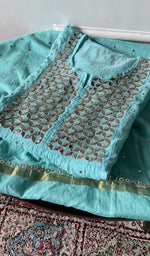 将图像加载到图库查看器中， Turquoise mul chanderi kurta piece folded, badla and mukaish work in view