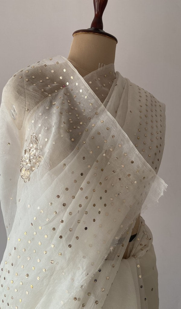 Off white pure organza silk saree draped on the mannequin