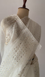 Off white pure organza silk saree draped on the mannequin