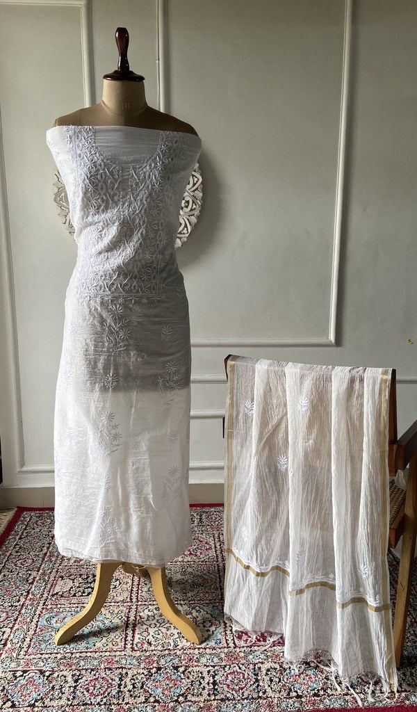 White mul chanderi chikankari 2 pc unstitched suit set laid out