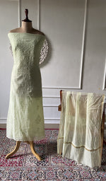 Load image into Gallery viewer, Pale lime mul chanderi chikankari 3 pc unstitched suit set laid out