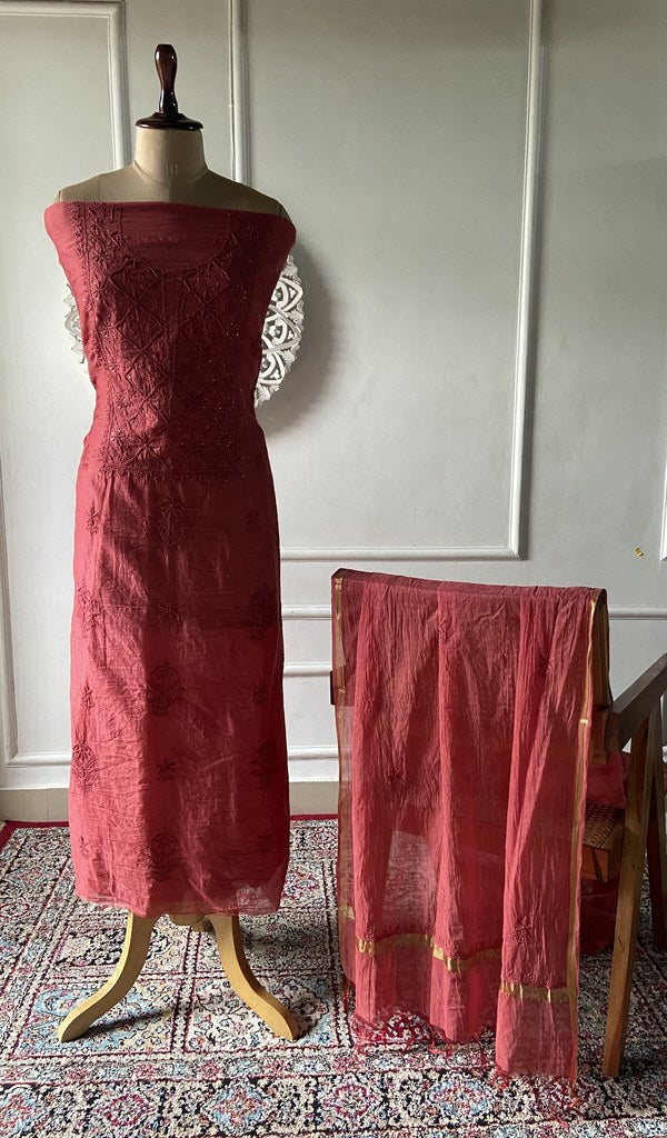 Coral red mul chanderi chikankari 3 pc unstitched suit set laid out
