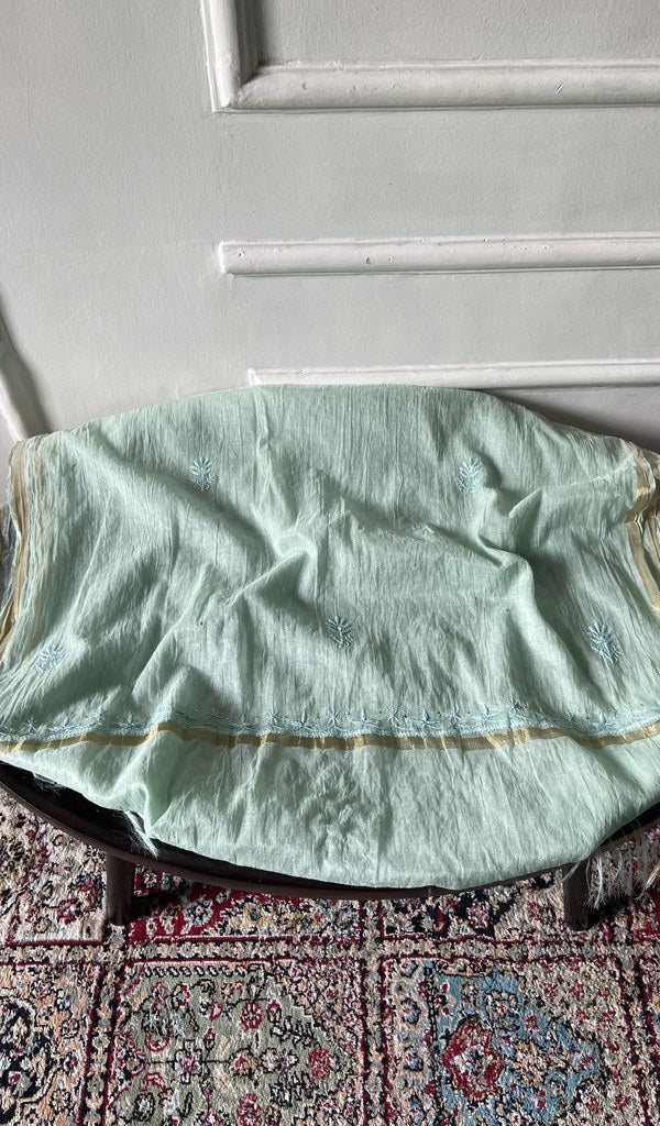 Chikankari across the body of the mint kurta piece