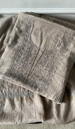 beige pure mul chanderi kurta piece folded, fine chikankari with beads cutdana and sequins on neck
