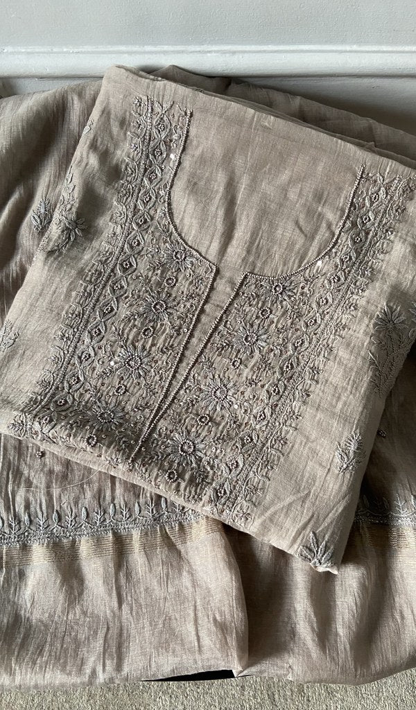 beige pure mul chanderi kurta piece folded, fine chikankari with beads cutdana and sequins on neck