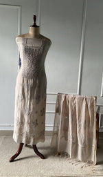 The set on the mannequin with its dupatta beside it