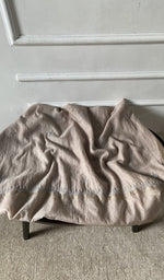 Bottom fabric draped over the stool
