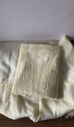 Folded yellow pure mul chanderi kurta piece with chikankari on the panel