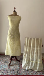 Yellow pure mul chanderi chikankari suit set on the mannequin with its dupatta