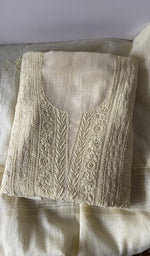 Folded kurta piece and dupatta, chikankari along the hem