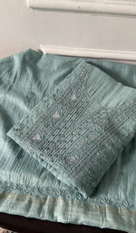 Load image into Gallery viewer, powder blue chikankari set folded, worked panel on top