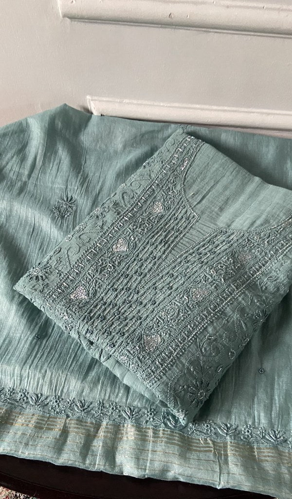 powder blue chikankari set folded, worked panel on top