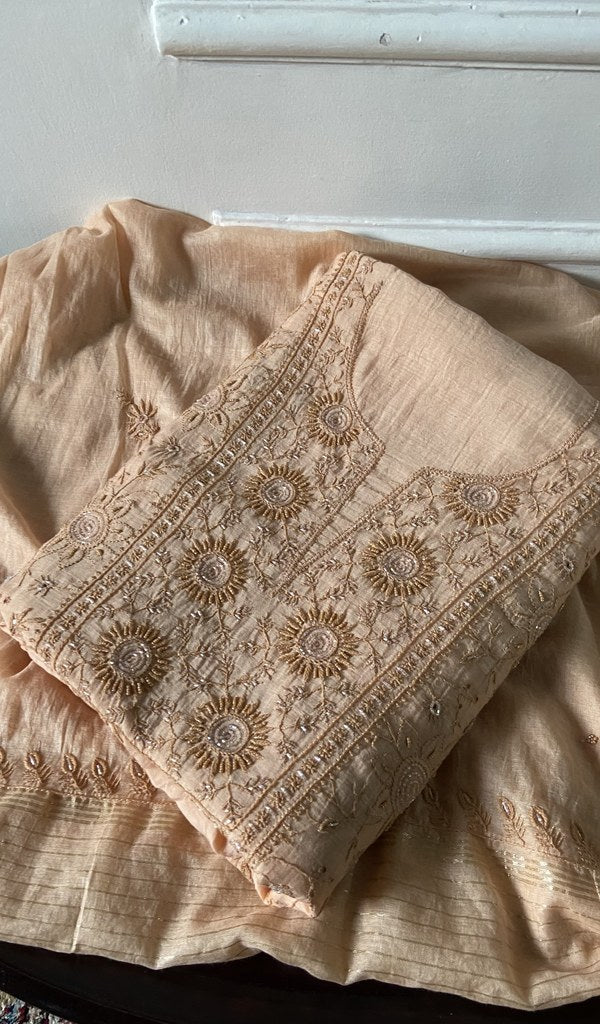 peach chikankari set folded, worked panel on top