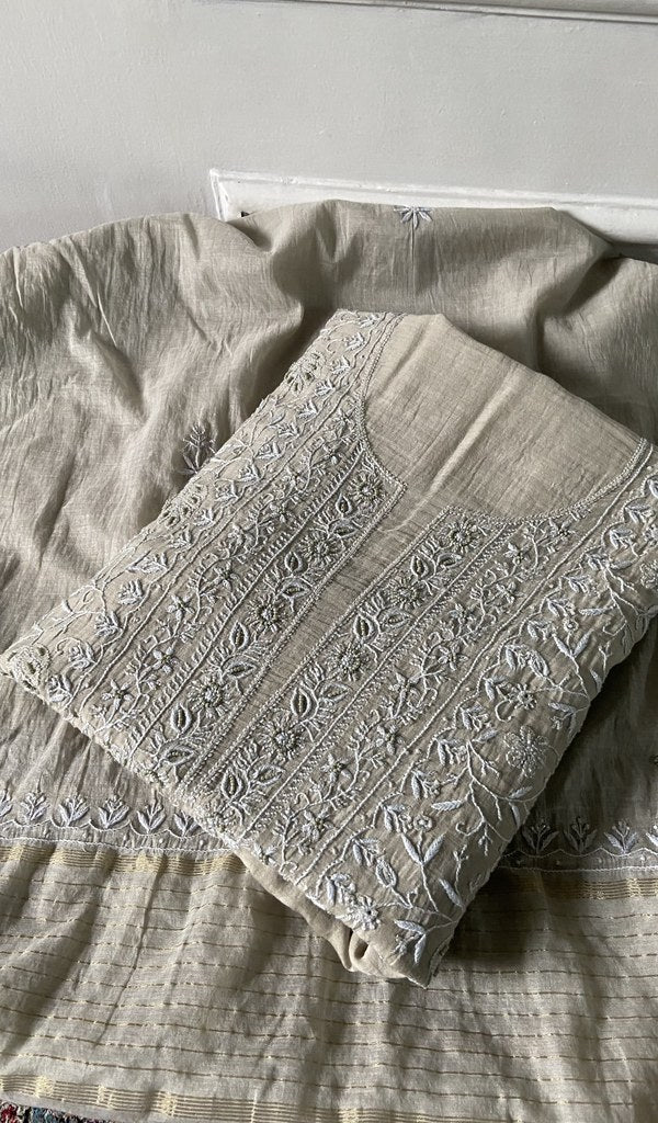 ivory chikankari set folded, worked panel on top