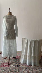 The set on the mannequin with its dupatta beside it