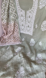 Motifs across the body of the green kurta