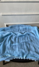 Bottom fabric draped over the stool