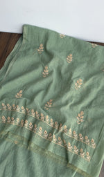 The dupatta spread out, sage green mul chanderi