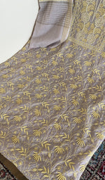 Kurta laid flat with the dupatta, do taar and teen taar jaaldar chikankari
