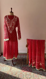 The set on the mannequin with its dupatta beside it