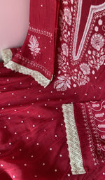 Motifs across the body of the red kurta