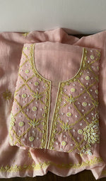 Folded kurta piece and dupatta, chikankari in lime thread along the hem