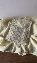 Folded beige pure mul chanderi kurta piece with chikankari on the panel