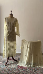 Beige pure mul chanderi chikankari suit set on the mannequin with its dupatta