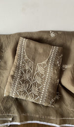 Beige pure organza silk kurta piece folded, do taar and teen taar chikankari