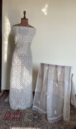 White organza silk set on the mannequin with its dupatta