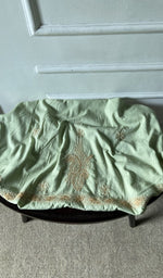 bottom laid out, green pure mul cotton