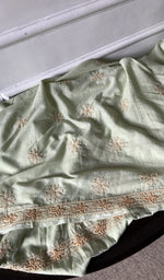 border and hem of the green kurta piece