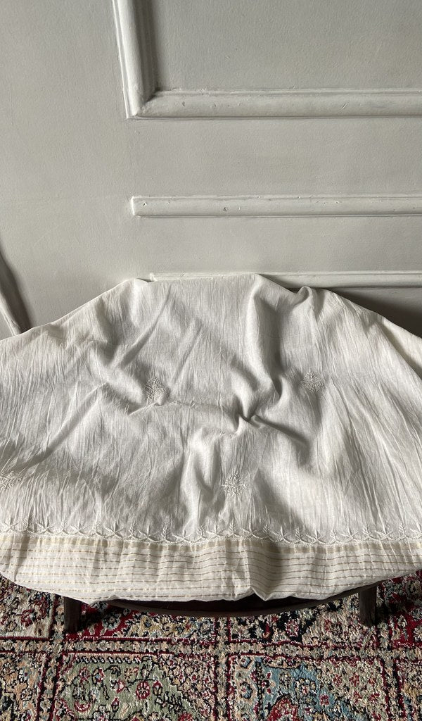Chikankari across the body of the off kurta piece