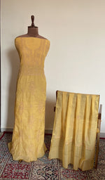 Mustard mul chanderi set on the mannequin with its dupatta