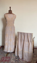 Beige mul chanderi set on the mannequin with its dupatta