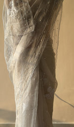 Cream saree on the mannequin, close view