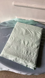 turquoise cotton kurta piece folded, fine chikankari