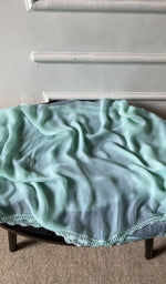 Bottom fabric draped over the stool