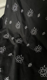 close view of the fine chikankari with rose motifs