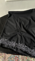 border and hem of the black kurta piece