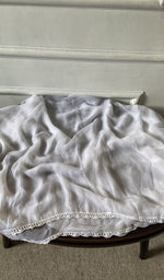 Bottom fabric draped over the stool