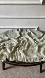 Bottom fabric draped over the stool