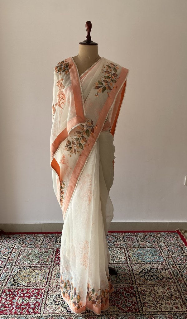 Off white pure organza silk saree draped on the mannequin
